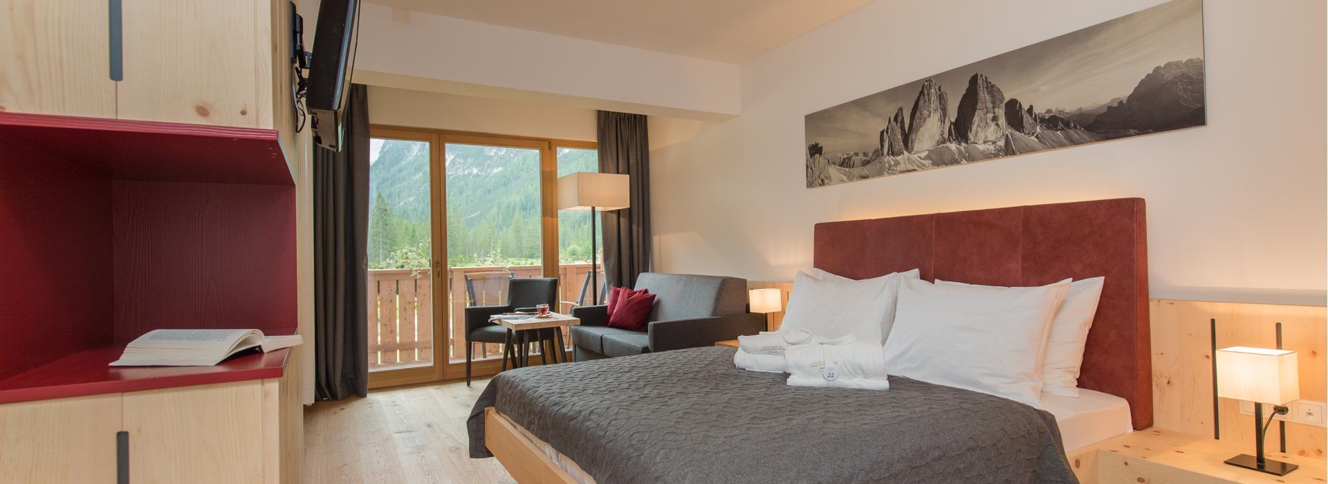 Doppelzimmer Sepp Innerkofler Süd mit Sitzecke und Balkon