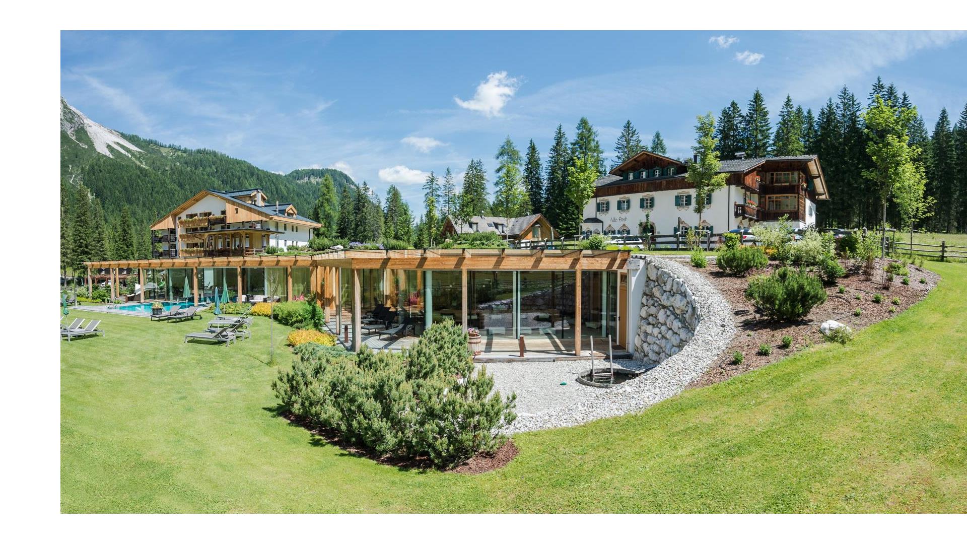 Hotel Dolomitenhof with bathhouse and garden during the summer