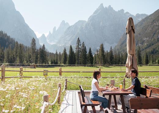Two people on the terrace of the bistro